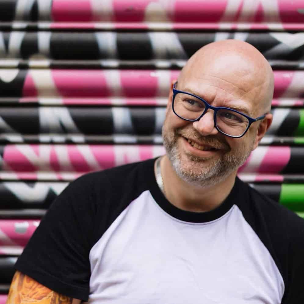 Paul Phipps-WIlliams by a graffiti wall