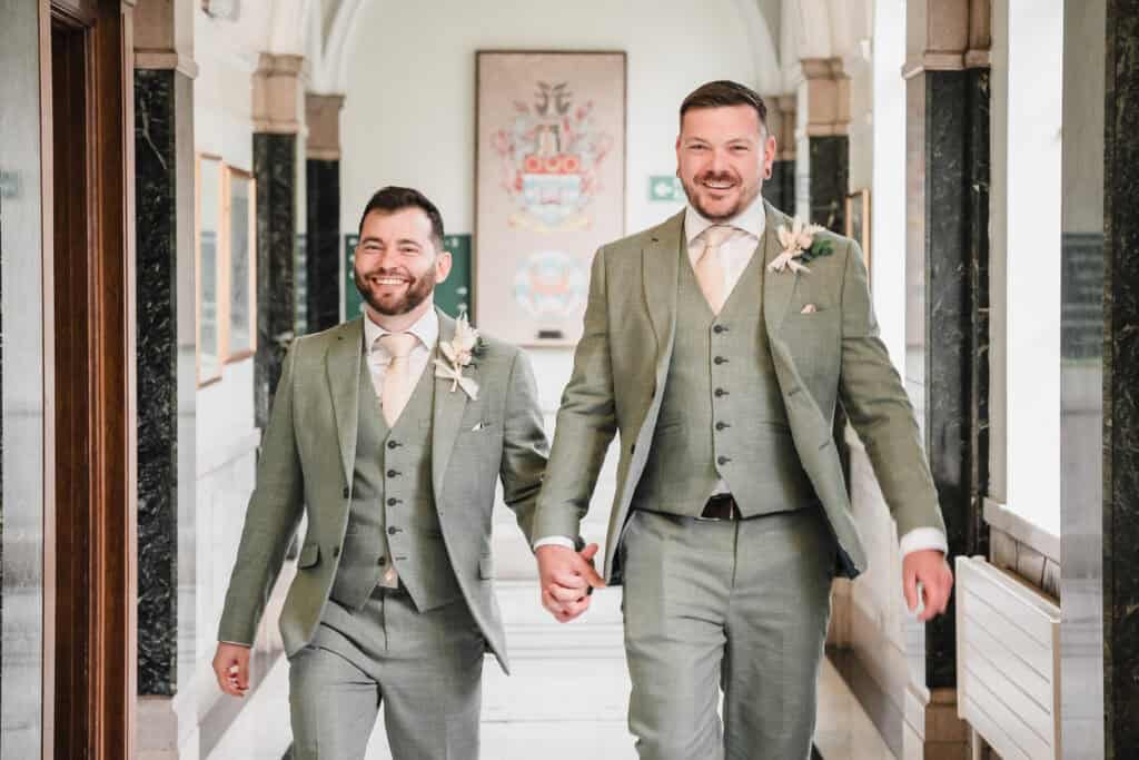 two grooms after their wedding at islington town hall